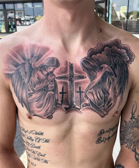 angel with a cross tattoo|realistic cross tattoos.